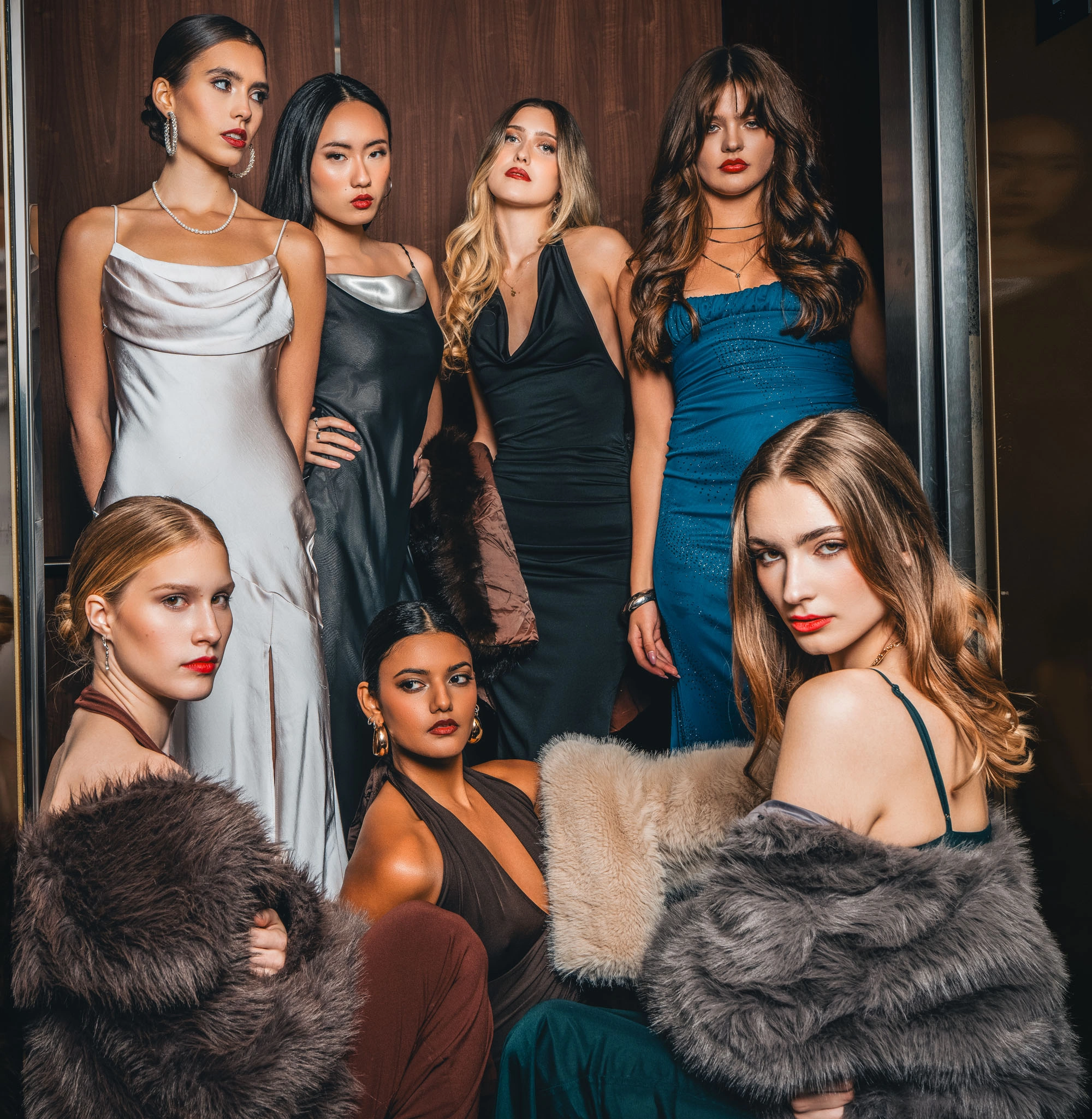 Female model group portrait in elevator from Night in Arras Vancouver