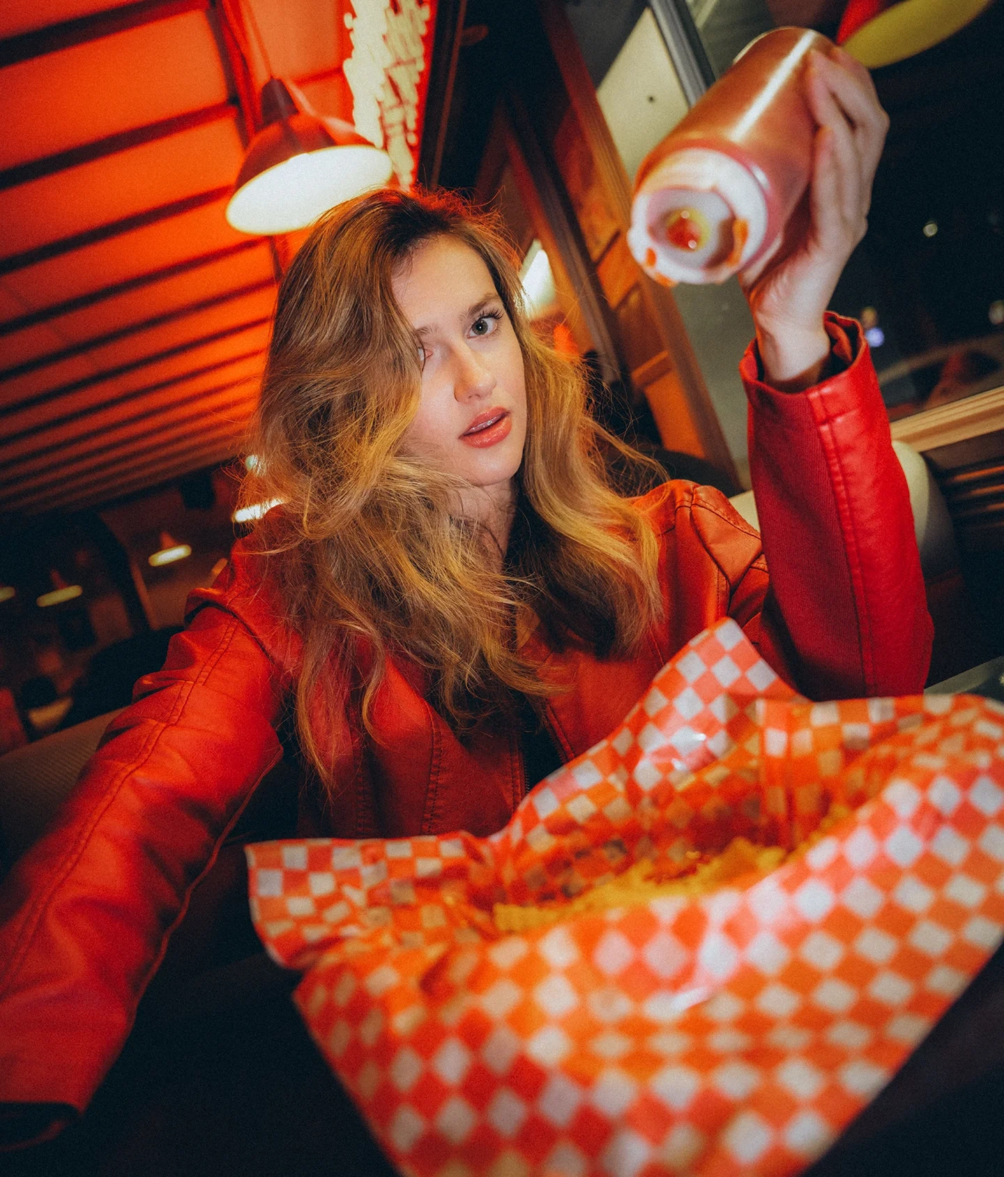 Lizzie editorial portrait with retro diner atmosphere