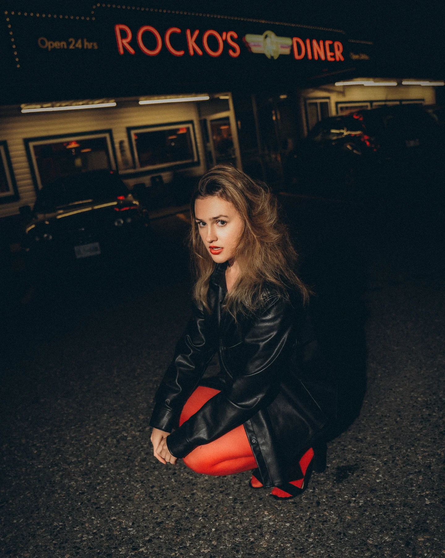 Diner booth portrait of Lizzie in editorial styling