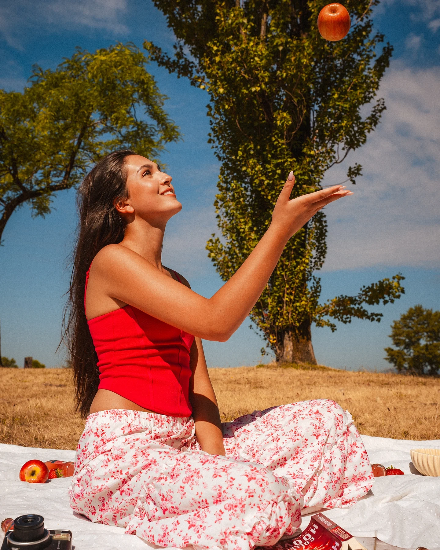 Daniela portrait with grassy landscape and clear sky backdrop